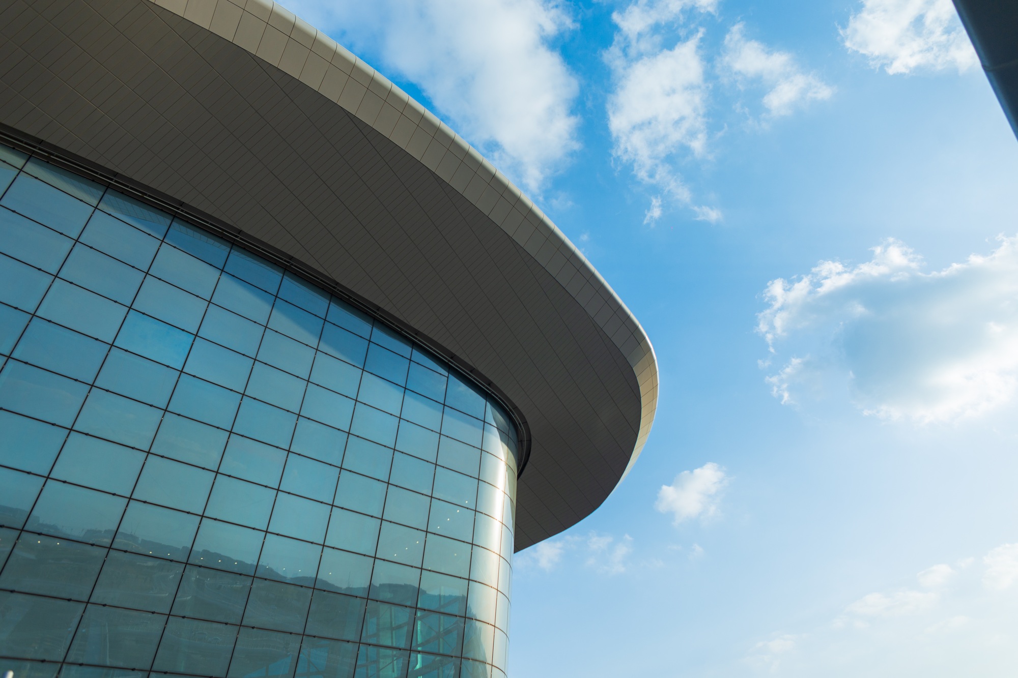 Airport building with glass and lines in Abu Dhabi, UAE